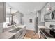 Modern kitchen with stainless steel appliances and gray cabinets at 2937 Bough Ave # D, Clearwater, FL 33760