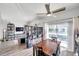 Dining area with wood table and chairs, and a view into the living room at 2937 Bough Ave # D, Clearwater, FL 33760
