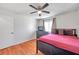 Well-lit bedroom with a double bed, dresser, and ceiling fan at 2937 Bough Ave # D, Clearwater, FL 33760