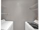 Laundry room with washer, dryer, and ample shelving at 2937 Bough Ave # D, Clearwater, FL 33760