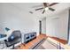 Bright bedroom with wood floors, ceiling fan, and built-in closet at 2937 Bough Ave # D, Clearwater, FL 33760