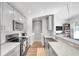 Modern kitchen with stainless steel appliances and gray cabinets at 2937 Bough Ave # D, Clearwater, FL 33760