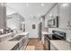 Modern kitchen with stainless steel appliances and gray cabinets at 2937 Bough Ave # D, Clearwater, FL 33760