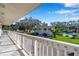 Balcony view of a community with lush landscaping, parking, and a pool at 2937 Bough Ave # D, Clearwater, FL 33760