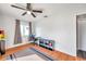Bedroom with wood floors, window, ceiling fan, and closet at 2937 Bough Ave # D, Clearwater, FL 33760