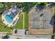 Aerial view of kidney-shaped pool and tennis court at 2937 Bough Ave # D, Clearwater, FL 33760