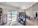 Bright living room with hardwood floors, large windows, and comfortable seating at 2937 Bough Ave # D, Clearwater, FL 33760