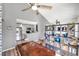 Dining area with wood table and chairs, open to kitchen and living room at 2937 Bough Ave # D, Clearwater, FL 33760