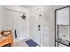 Condo entryway with white door, tiled floor, and built-in white shutters at 2937 Bough Ave # D, Clearwater, FL 33760