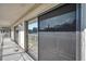 Private balcony with sliding glass doors and screen at 2937 Bough Ave # D, Clearwater, FL 33760