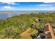View of waterfront property with lush trees and a bridge in the distance at 2937 Bough Ave # D, Clearwater, FL 33760