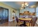 Charming dining area with round wooden table and four chairs at 300 Pinellas S Way, St Petersburg, FL 33707