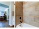 Bathroom with tub and shower, updated tile at 300 Pinellas S Way, St Petersburg, FL 33707