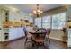 Cozy dining area with round table and chairs, updated cabinets at 300 Pinellas S Way, St Petersburg, FL 33707
