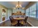 Bright dining area with a round table and four chairs near a window at 300 Pinellas S Way, St Petersburg, FL 33707