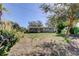 Charming single story home with a well manicured lawn and mature trees at 300 Pinellas S Way, St Petersburg, FL 33707