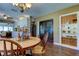 Kitchen and dining area with hardwood floors and French doors at 300 Pinellas S Way, St Petersburg, FL 33707