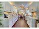 Modern kitchen with white cabinets, stainless steel appliances and hardwood floors at 300 Pinellas S Way, St Petersburg, FL 33707