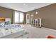 Charming bedroom with twin beds, built-in shelving, and plenty of natural light at 30684 Penny Surf Loop, Wesley Chapel, FL 33545