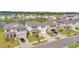 Aerial view of houses and street at 30684 Penny Surf Loop, Wesley Chapel, FL 33545