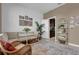 Cozy sitting area featuring a beige couch and a round table at 30684 Penny Surf Loop, Wesley Chapel, FL 33545