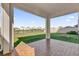 Enjoy the view of the pond from this covered patio at 30684 Penny Surf Loop, Wesley Chapel, FL 33545