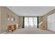 Spacious playroom with large windows, neutral walls, and plenty of space for toys at 30684 Penny Surf Loop, Wesley Chapel, FL 33545