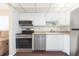 Efficient kitchen with stainless steel appliances and white cabinets at 315 30Th W Ave # B201, Bradenton, FL 34205