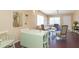 Bright dining area adjacent to living room, featuring a light green table and chairs at 315 30Th W Ave # B201, Bradenton, FL 34205