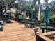 Community patio with seating and umbrellas at 315 30Th W Ave # B201, Bradenton, FL 34205