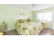 Bedroom with leafy bedding, a dresser and a desk at 315 30Th W Ave # B201, Bradenton, FL 34205