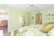 Bright bedroom with leafy bedding and a view of the living room at 315 30Th W Ave # B201, Bradenton, FL 34205
