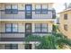 View of building showing multiple balconies and entrances at 315 30Th W Ave # B201, Bradenton, FL 34205