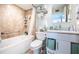 Updated bathroom with a walk-in shower and modern vanity at 423 S Paula Dr # 204, Dunedin, FL 34698