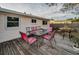 Deck with table and chairs, perfect for outdoor dining at 1619 Coppertree Dr, Tarpon Springs, FL 34689