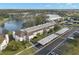 Aerial view of condo building, parking and surrounding landscape at 165 Lakeview Way # 165, Oldsmar, FL 34677