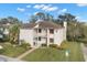 Two-story condo building with balcony and landscaping at 165 Lakeview Way # 165, Oldsmar, FL 34677