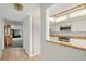 Kitchen with white cabinets, granite counters, and stainless steel appliances at 165 Lakeview Way # 165, Oldsmar, FL 34677