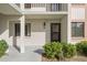 Exterior view of condo building with landscaping and parking at 165 Lakeview Way # 165, Oldsmar, FL 34677