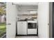 Laundry room with washer and dryer, and additional storage shelves at 165 Lakeview Way # 165, Oldsmar, FL 34677