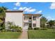 Two-story condo building with walkway and landscaping at 165 Lakeview Way # 165, Oldsmar, FL 34677