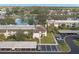 Aerial view of condo building, parking and community landscape at 165 Lakeview Way # 165, Oldsmar, FL 34677