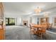 Living room with fireplace, dining area, and grey carpet at 165 Lakeview Way # 165, Oldsmar, FL 34677