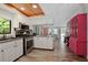 Bright kitchen featuring stainless steel appliances and wood-look flooring at 1820 1/2 N Washington Ave, Clearwater, FL 33755