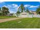 Light green house with a two-car garage and a well-maintained lawn at 3887 50Th S Ave, St Petersburg, FL 33711