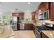 Modern kitchen with stainless steel appliances and granite countertops at 3887 50Th S Ave, St Petersburg, FL 33711