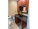 Bathroom with dark wood vanity and black sink at 3887 50Th S Ave, St Petersburg, FL 33711