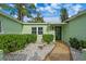 Front entrance with stone walkway and landscaping at 3887 50Th S Ave, St Petersburg, FL 33711