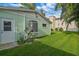 House's backyard with AC unit and lush grass at 3887 50Th S Ave, St Petersburg, FL 33711