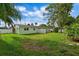 Spacious backyard with lush grass and a wooden fence at 3887 50Th S Ave, St Petersburg, FL 33711